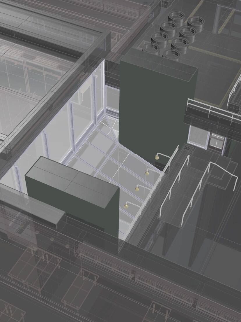 A detailed CAD model of a building, with semi-transparent walls showing objects and rooms within.